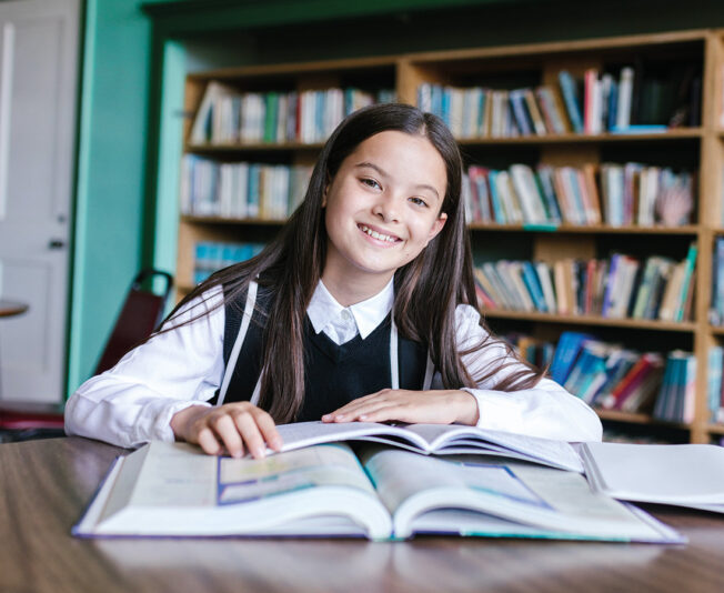 Female-student-studying-from-books