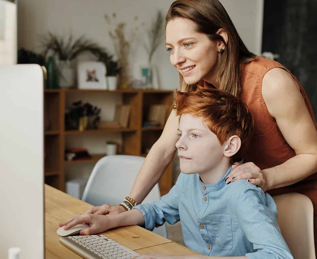 Mother-and-Son-on-the-computer-during-an-online-tuition-session-with-JK-Educate