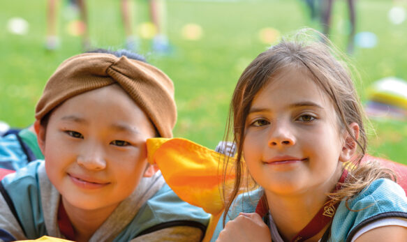 Two students smiling at the camera at camp dragon