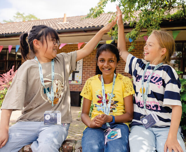 Twyford-three-female-students-celebrating-and-smiling