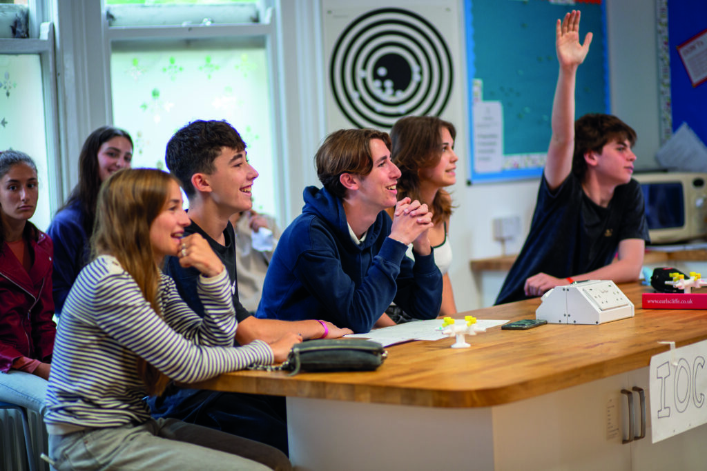 Engaging students participating in summer boarding courses classroom activity.