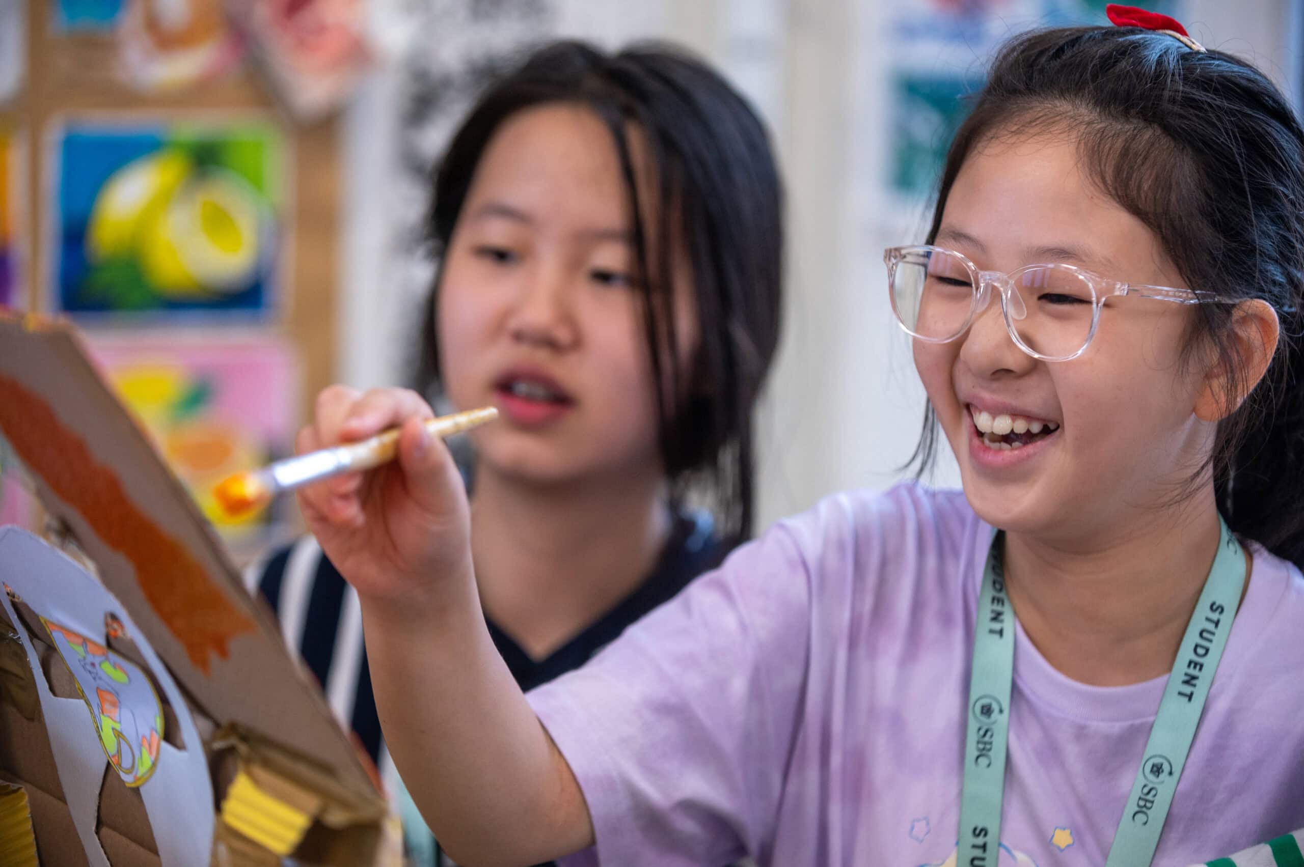 Creative children engaging in arts and crafts at a summer boarding school.