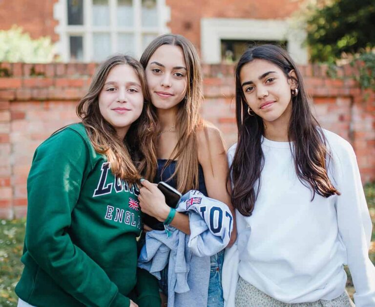 Students smiling together on campus